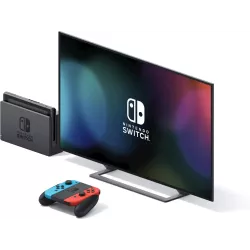 Console Nintendo Switch inseree dans sa station d accueil devant un ecran de television