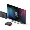 Console Nintendo Switch inseree dans sa station d accueil devant un ecran de television